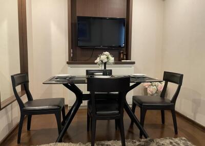 Dining room with glass-top table and chairs