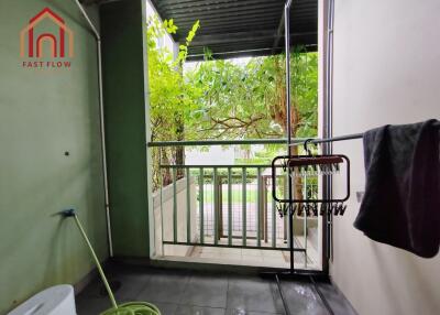 Covered balcony area with greenery view