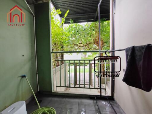 Covered balcony area with greenery view