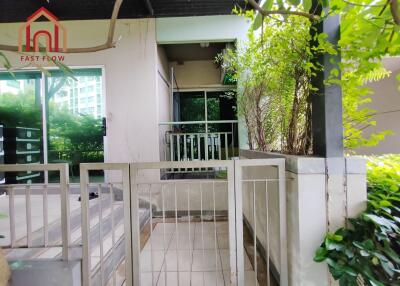 Entrance with gate and greenery