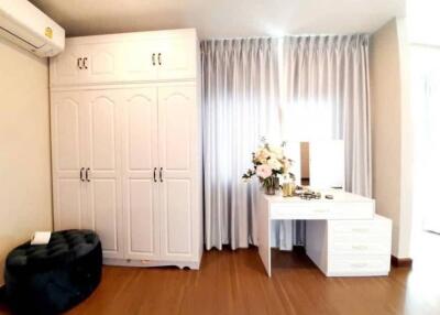 Modern bedroom with wardrobe and vanity desk