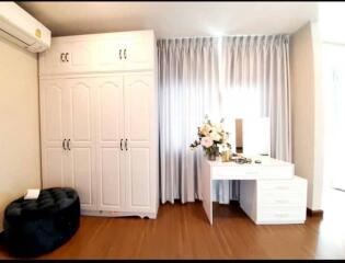 Modern bedroom with wardrobe and vanity desk