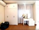 Modern bedroom with wardrobe and vanity desk