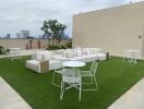 Rooftop patio with seating area and tables