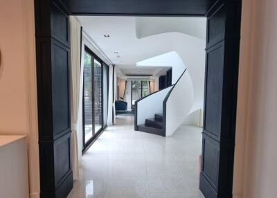 Elegantly designed hallway with a staircase