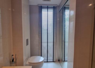 Modern bathroom with large window and blinds