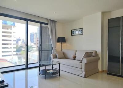 Modern living room with large windows and a couch