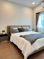 Modern bedroom with double bed and bedside tables