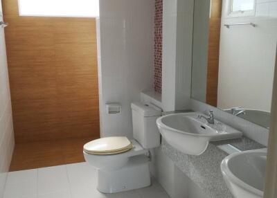 Modern bathroom with dual sinks and large mirror