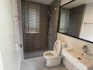 Modern bathroom with walk-in shower and large mirror