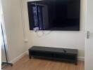 Bedroom with TV on wall