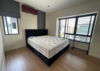 Bright and spacious empty bedroom with large windows