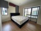 Bright and spacious empty bedroom with large windows