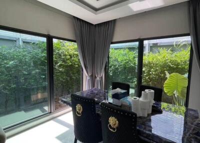 Dining room with large windows and garden view