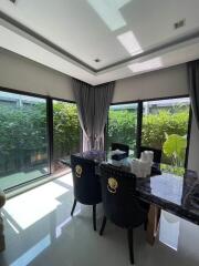 Dining room with large windows and garden view