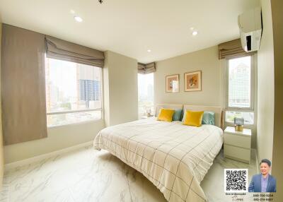 Bright bedroom with large windows