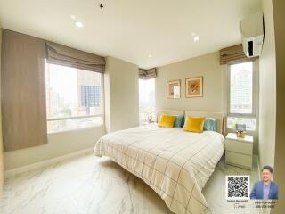 Bright bedroom with large windows