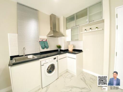 Modern kitchen with integrated laundry