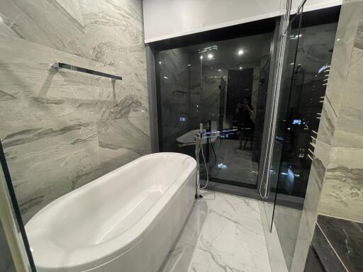 Modern bathroom with bathtub and large window