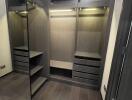 Spacious walk-in closet with built-in shelving and hanging space