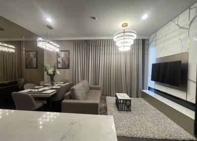 Modern living room with dining area and TV