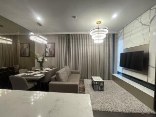 Modern living room with dining area and TV