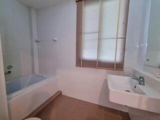 Bathroom with bathtub and sink