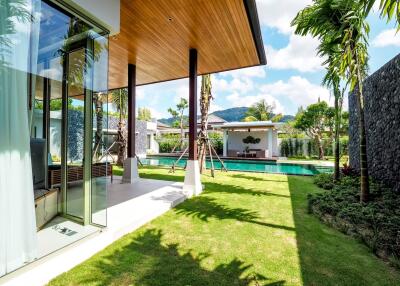 Modern outdoor living area with pool and garden