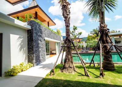 Luxurious outdoor area with pool and greenery