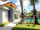 Luxurious outdoor area with pool and greenery