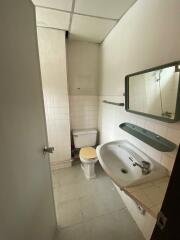 basic bathroom with white tiles and a sink