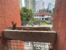 Balcony with urban view and planter