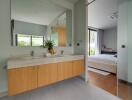 Modern bathroom with a view of the bedroom