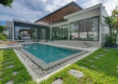 Exterior view of a modern house with a swimming pool