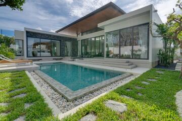 Exterior view of a modern house with a swimming pool