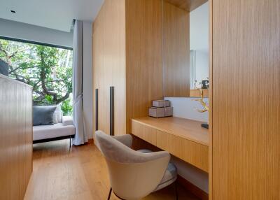 Modern bedroom with a work desk and large window