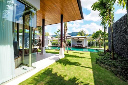 View of a modern outdoor space with a pool and garden