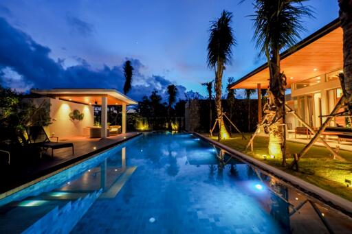 Modern outdoor area with pool and evening lighting