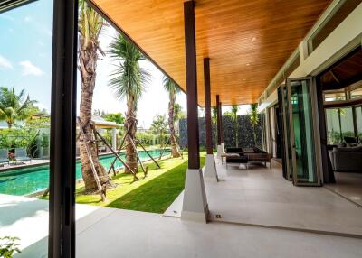 Modern patio area with pool and garden