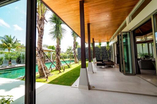 Modern patio area with pool and garden