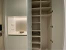 Built-in storage unit with shelves and small counter space