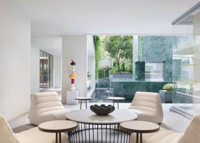 Modern living room with white furniture and large window