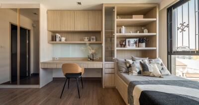 Modern bedroom with built-in desk and storage