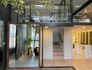 Modern mezzanine living area with indoor plants and stylish furnishings