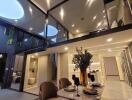 Modern, well-lit interior with mezzanine, dining area, and stylish decor