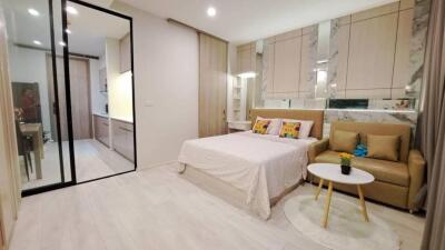 Stylish and modern bedroom with attached kitchenette