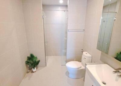 Modern bathroom with glass-enclosed shower