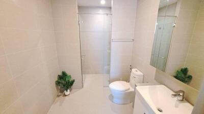 Modern bathroom with glass-enclosed shower