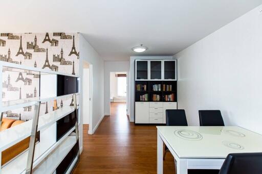 Dining area with table and chairs adjacent to living space