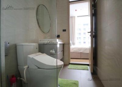 Modern bathroom with view into bedroom